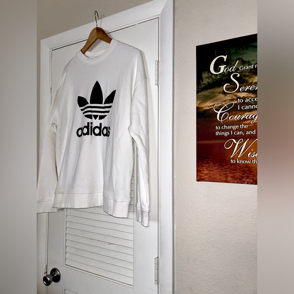 white adidas that’s not used, has a small yellow stain on the left hand side